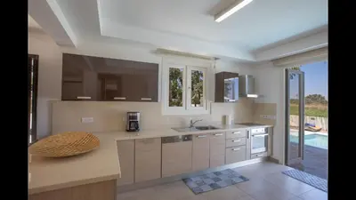 a kitchen with a sink and a counter top at Protaras Katerina Villa Kv53 in Paralimni