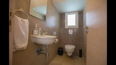 a bathroom with a sink and a toilet at Protaras Katerina Villa Kv53 in Paralimni