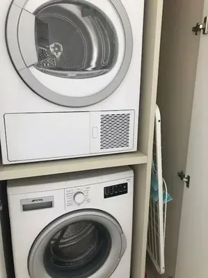 a dryer and a washing machine in a room at PROTEA RESIDENCE with private terrace in Nicosia