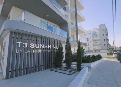 a building with a sign that reads its sunshine by lighter property at STAY Digital Den Apartment in Larnaka