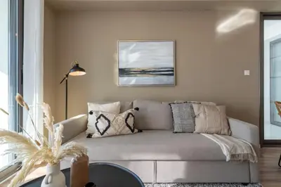 a living room with a couch and a table at Stars 1-Bedroom Apartment in Larnaca in Larnaka