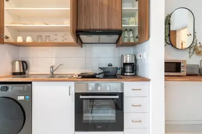 a kitchen with a stove and a dishwasher at Moon Light 1-Bedroom Apartment in Larnaca in Larnaka