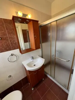 a bathroom with a toilet and a sink and a shower at The Brilliant Villa in Protaras