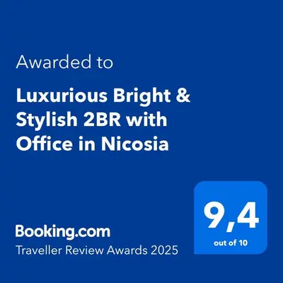 a blue sign with the text awarded to luminous bright andsplash at Luxurious Bright & Stylish 2BR with Office in Nicosia in Nicosia