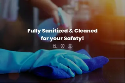 a person with a cleaning glove on a table at Serenity Waves Villa 12 in Sophtadhes