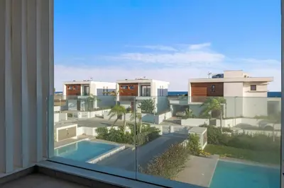 a view of a building from a window at Serenity Waves Villa 12 in Sophtadhes