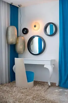 a room with a mirror and a table with a chair at Exquisite Protaras Villa Villa Bulat 4 Bedrooms Beachfront in Protaras