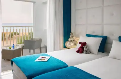 a bedroom with a bed with teddy bears on it at Exquisite Protaras Villa Villa Bulat 4 Bedrooms Beachfront in Protaras