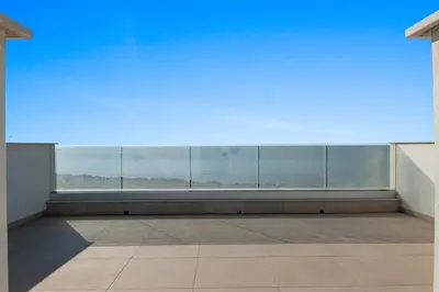 an empty room with a large window in a building at Serenity Waves Villa 3 in Sophtadhes