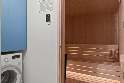 a door to a bathroom with a washing machine at Serenity Waves Villa 3 in Sophtadhes