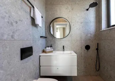 a bathroom with a white sink and a mirror at Magnificent Protaras Villa Villa Chelsea 3 Bedrooms Private Outdoor Pool in Protaras