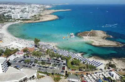 an aerial view of a beach with a crowd of people at Premium Protaras Villa Villa Mine 2 Bedrooms Private Outdoor Pool in Protaras