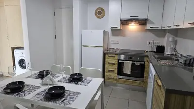 a kitchen with white appliances and a white counter top at STAY Arpa Suite in Protaras
