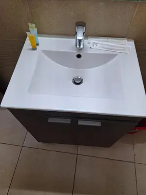a bathroom sink with a white counter top at Paradise by the Sea in Larnaka