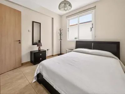 a bedroom with a large bed and a window at Villa Ioli - 3BR Retreat near Kalamies Beach in Protaras