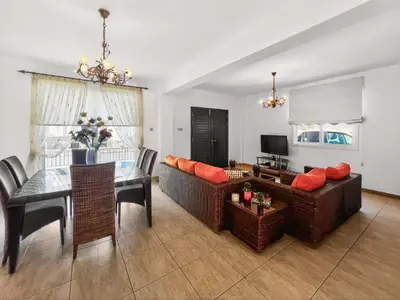 a living room with a couch and a table at Villa Ioli - 3BR Retreat near Kalamies Beach in Protaras
