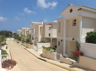 a row of white houses on a street at Stylish & Picturesque Oasis Anthorina 2 in Protaras