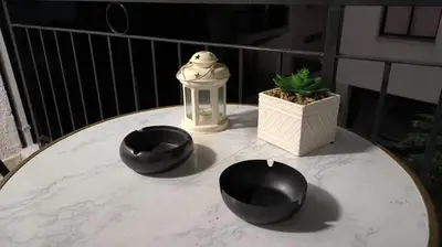 a table with two black bowls on a balcony at SPECIAL OFFER -70 Percent Off - 2 BR - Sleep 7 - Best Location at Ayia Napa City Center in Ayia Napa