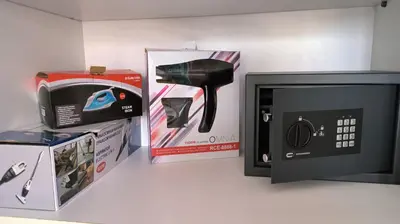 a microwave next to a box and a microwave oven at SPECIAL OFFER -70 Percent Off - 2 BR - Sleep 7 - Best Location at Ayia Napa City Center in Ayia Napa