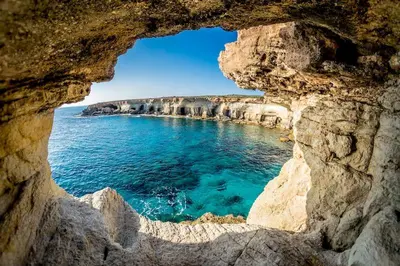 a view of the ocean through a rock cave at SPECIAL OFFER -70 Percent OFF - Sleep 5 - Best Location - Free Parking in Ayia Napa