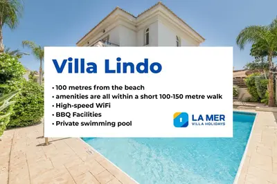 a sign in front of a villa with a swimming pool at Villa Lindo in Protaras