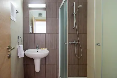 a bathroom with a sink and a shower at Prime Protaras Seafront Apt in Protaras