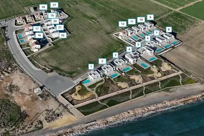 an aerial view of a resort complex next to the water at Serenity Waves Villa 1 in Sophtadhes