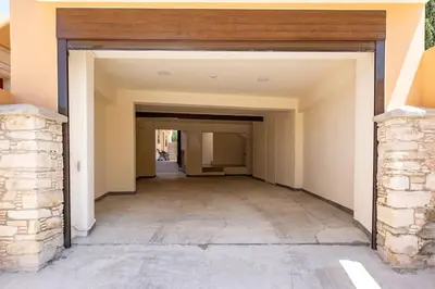 an empty hallway of a house with a brick wall at Traditional House Agia Varvara Village in Ayvaryara
