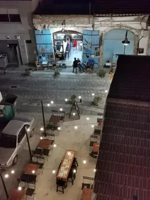 an overhead view of a stage with tables and chairs at Must Stay - Finikoudes Studio in Larnaka