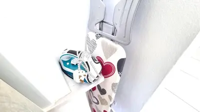 a pair of shoes hanging from the side of a door at Stylish Studio - 2 Minutes from Kastella Beach in Larnaka
