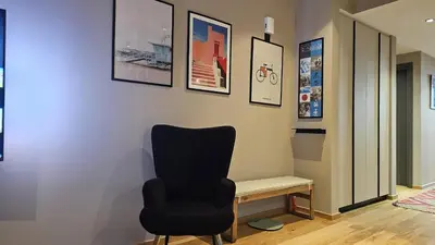 a chair sitting next to a desk in a room at STAY Lima Soul Apartment in Limassol