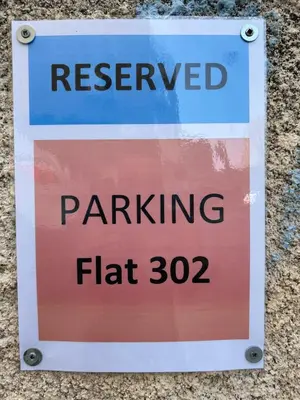 a sign that reads reserved parking at Nikoletta apartman in Limassol