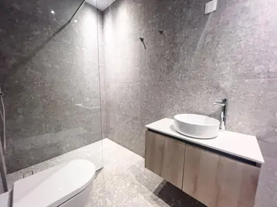a bathroom with a toilet and a sink and a shower at Azure Breeze Villa - Roof Garden & Sea Views in Protaras