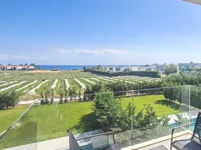 a view from the balcony of a house with a garden at Azure Breeze Villa - Roof Garden & Sea Views in Protaras
