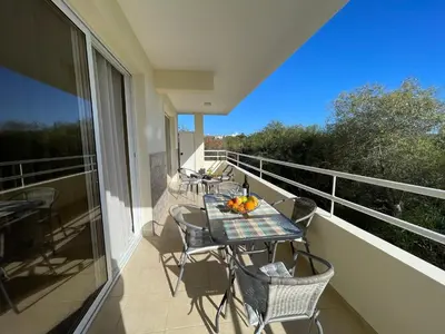 a balcony with a table and chairs on a balcony at Nissi Beach beautiful apartment in Ayia Napa