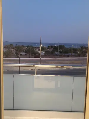 a view of a street from a window at IOLENA Seaview Apartment in Pyla