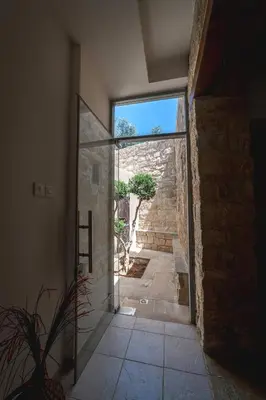 an entrance to a room with a glass door at Villa To Palati with Private Pool Anogyra in Anoyira
