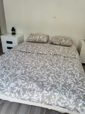 a bed with two pillows on it in a bedroom at Limassol mountain and sea views in Limassol