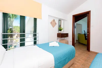 a hotel room with a bed and a window at Villa Heaven in Protaras