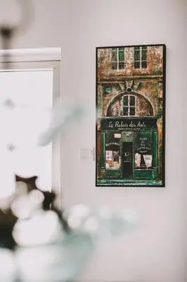 a picture of a building in a frame on a wall at Neapolis Residence Spacious Quiet Near beach in Limassol