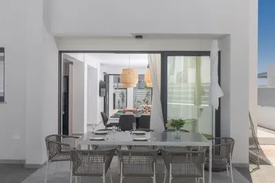 a dining room with a table and chairs at Semeli Villa 8 in Protaras