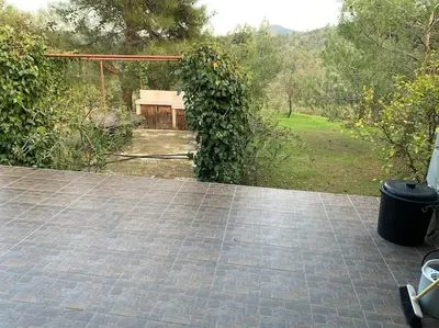 a view of a patio with a bench in a yard at Mountain View! Cosy life in Nicosia