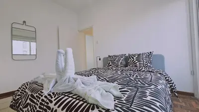 a bedroom with a bed with towels on it at STAY City Life Apartment I in Nicosia