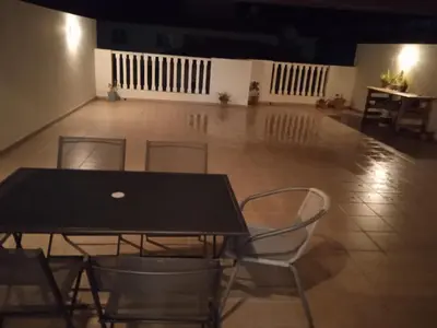 a black table and chairs in a room at Xylophagou Rest and Relax 4 Top floor Big Balcony 1 bedroom apartment in Xylophaghou