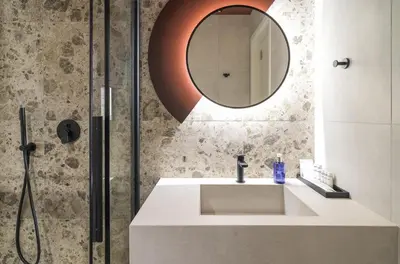 a bathroom with a sink and a mirror at Alinea Diono Historic Center in Limassol