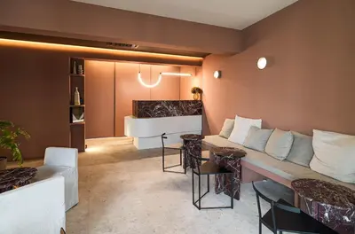 a living room with a couch and a piano at Alinea Diono Historic Center in Limassol