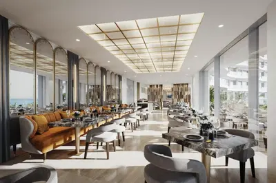 a restaurant with tables and chairs and windows at Del Mar 2 Bedroom Deluxe Seaside 'A' Residence in Limassol