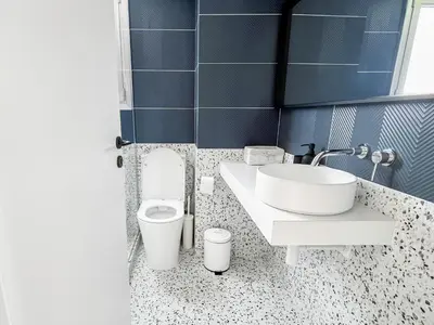 a bathroom with a sink and a toilet at Terrazzo style 2 bedroom 2bathroom Apartment in Larnaka
