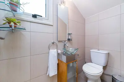 a bathroom with a toilet and a sink at Villa Jacqueline in Protaras