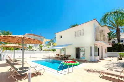a villa with a swimming pool and a house at Villa Anemona - 100m from Pernera Beach in Protaras